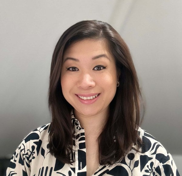Kristina Chu DeJesus professional headshot, black-and-white patterned blouse