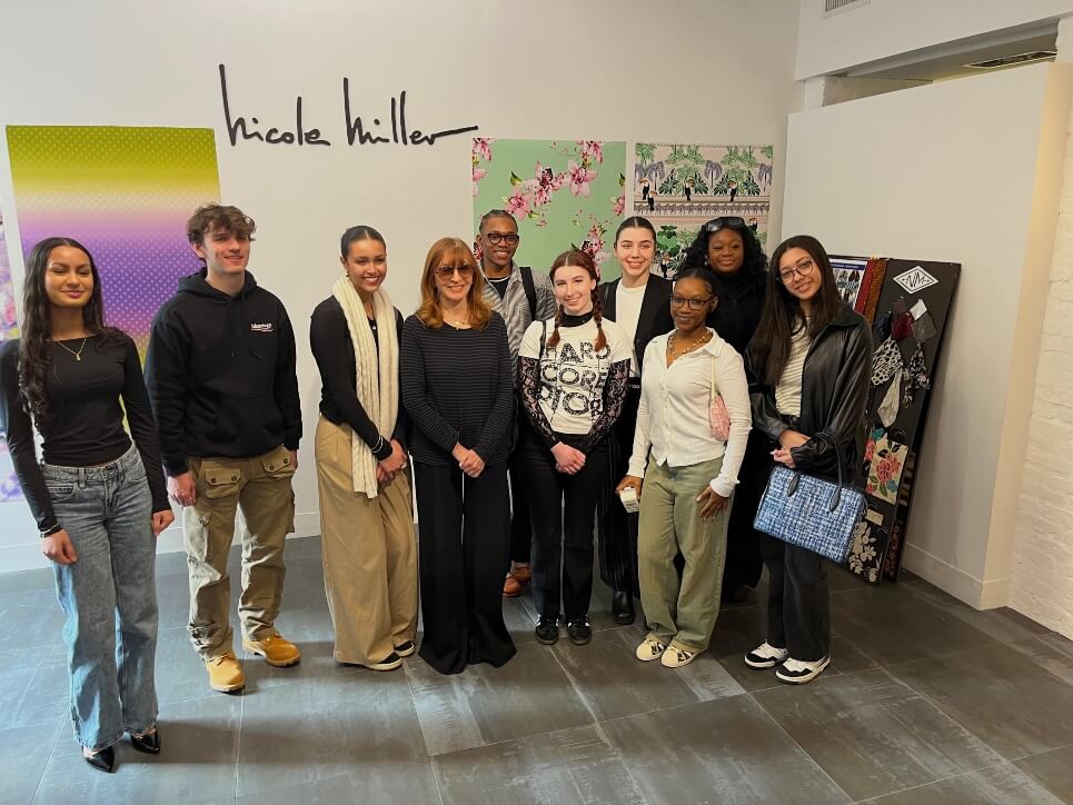 Nicole Miller with students in showroom