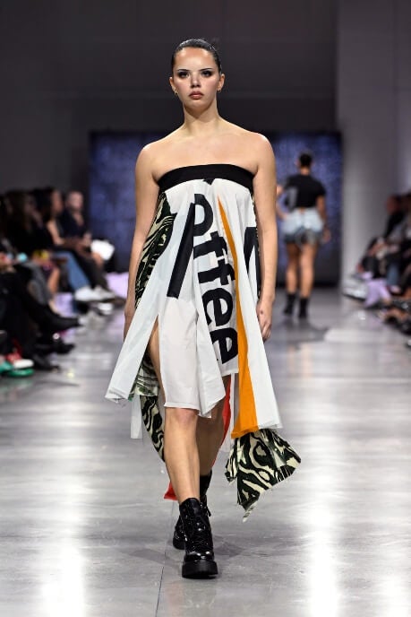 A model walking the runway at a fashion show