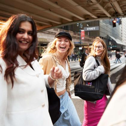 four female students walking on NYC streets