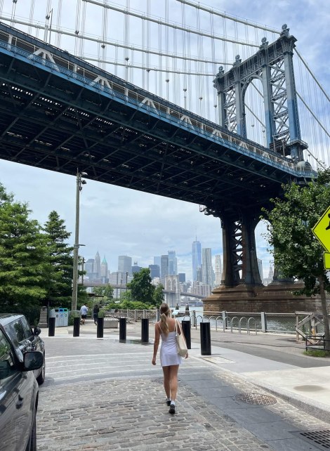 Girl walking bridge in front of her