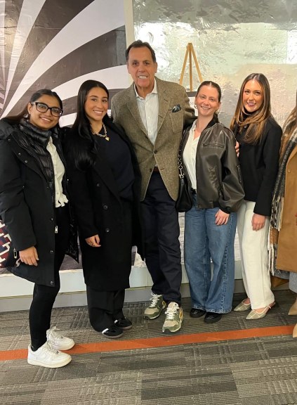 Sam Edelman with students on LIM's campus