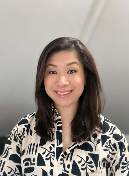 Kristina Chu DeJesus professional headshot, black-and-white patterned blouse