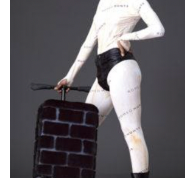 Model posing with Romeo Hunte’s blackglama tote bag, utility vest, and suitcase. 