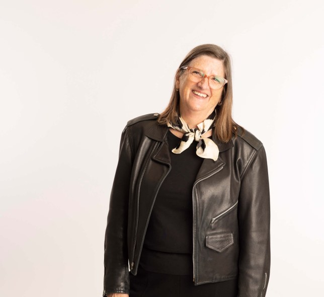 Professor Mitropoulos in leather jacket, white backdrop