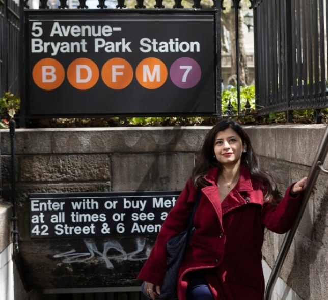 Female student, dark hair, exiting subway at 5th Avenue - Bryant Park Station