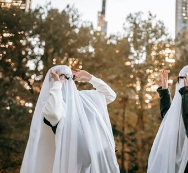 People in Central Park wearing ghost sheets