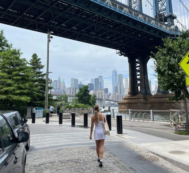 Girl walking bridge in front of her