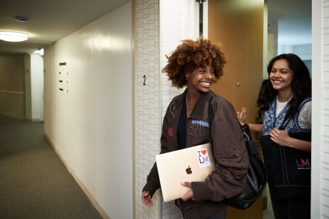 2 students in the hallway of FOUND Study