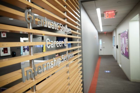 wooden wall with letters on it