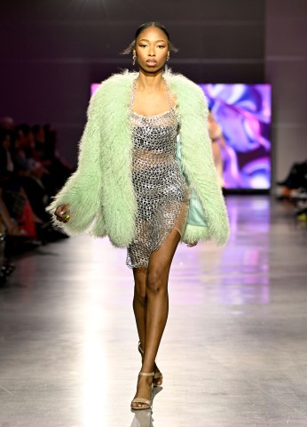 Green coat and silver dress 2024 fashion show look